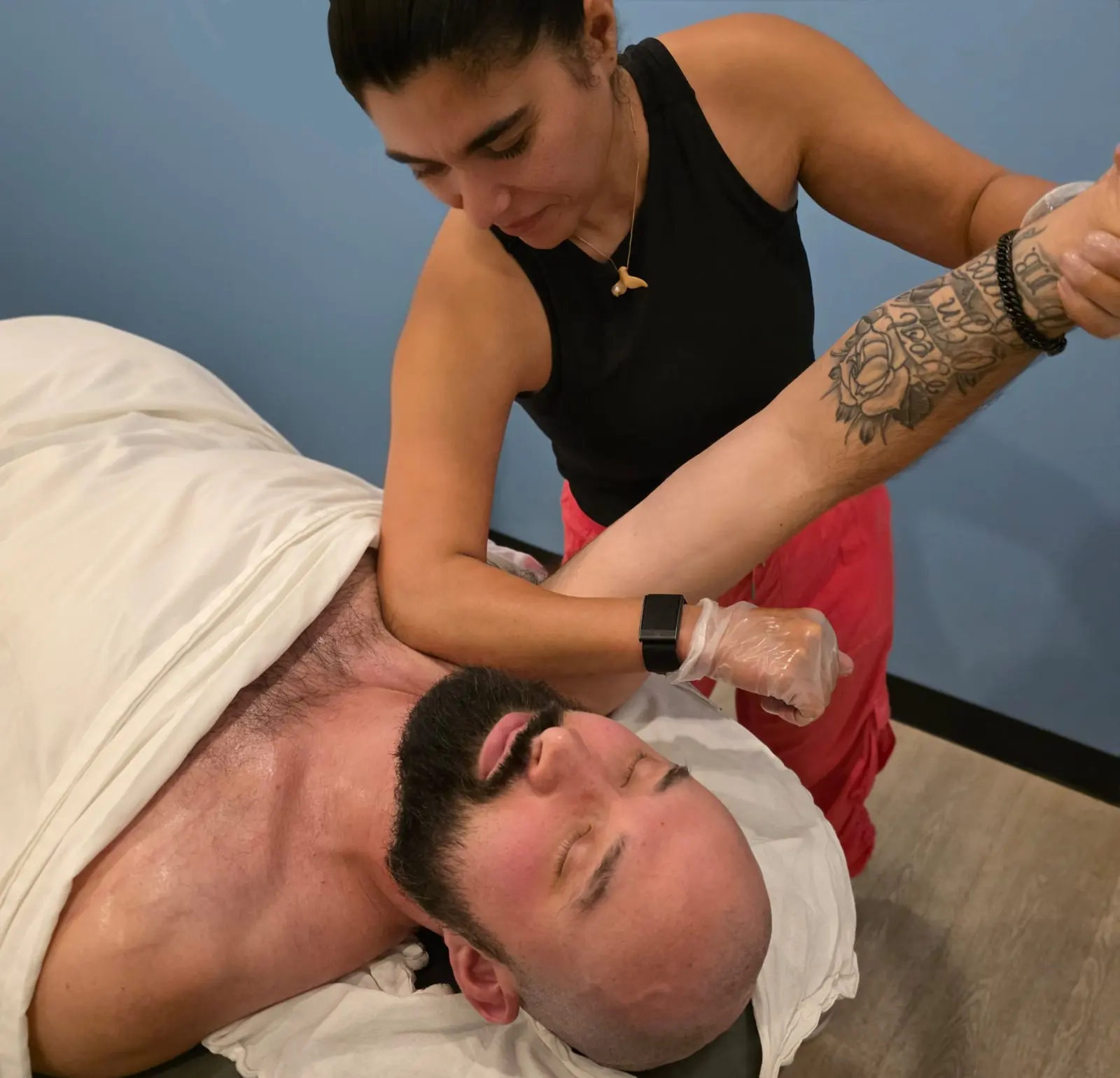 Registered massage therapist providing hands-on treatment