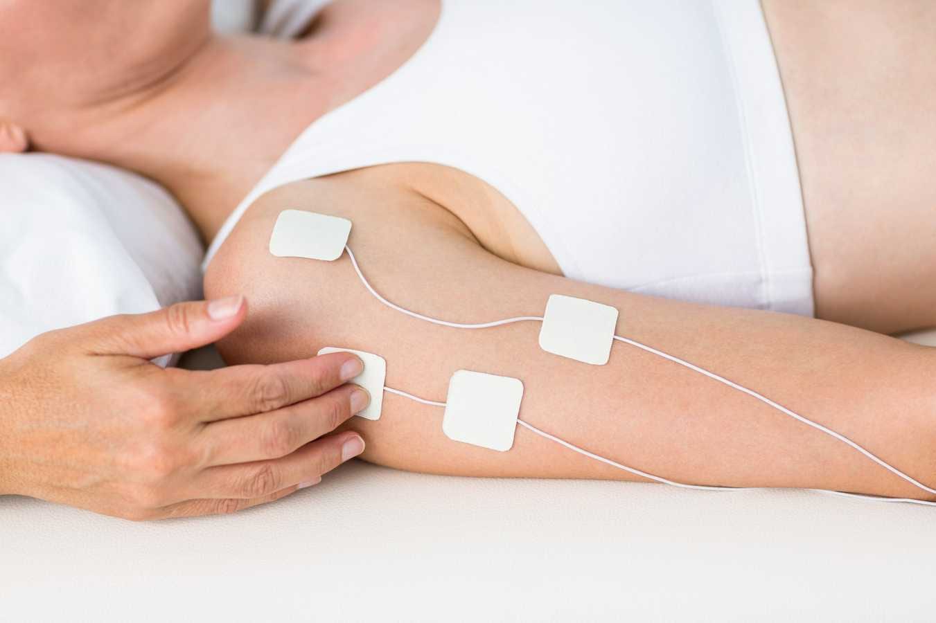 Physiotherapist working with woman