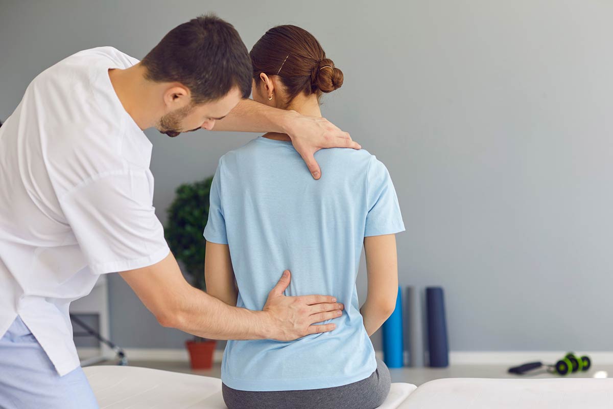 chiropractor working on womans back
