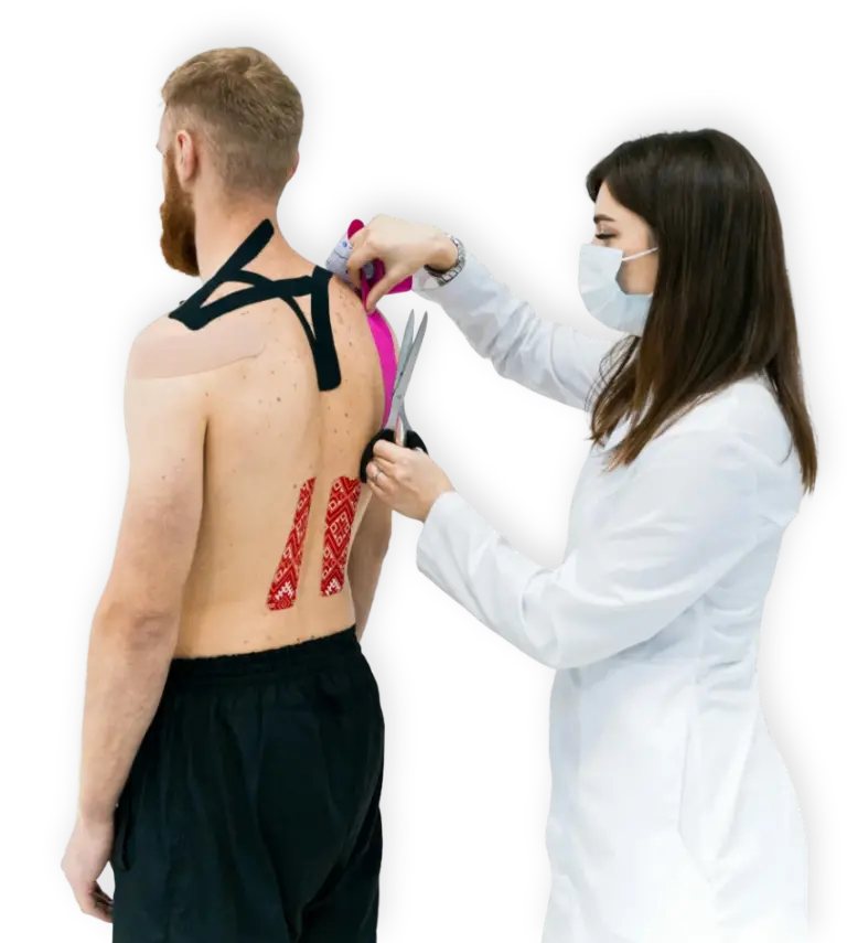 Healthcare professional applying kinesiology tape to a patient's back in North Vancouver.